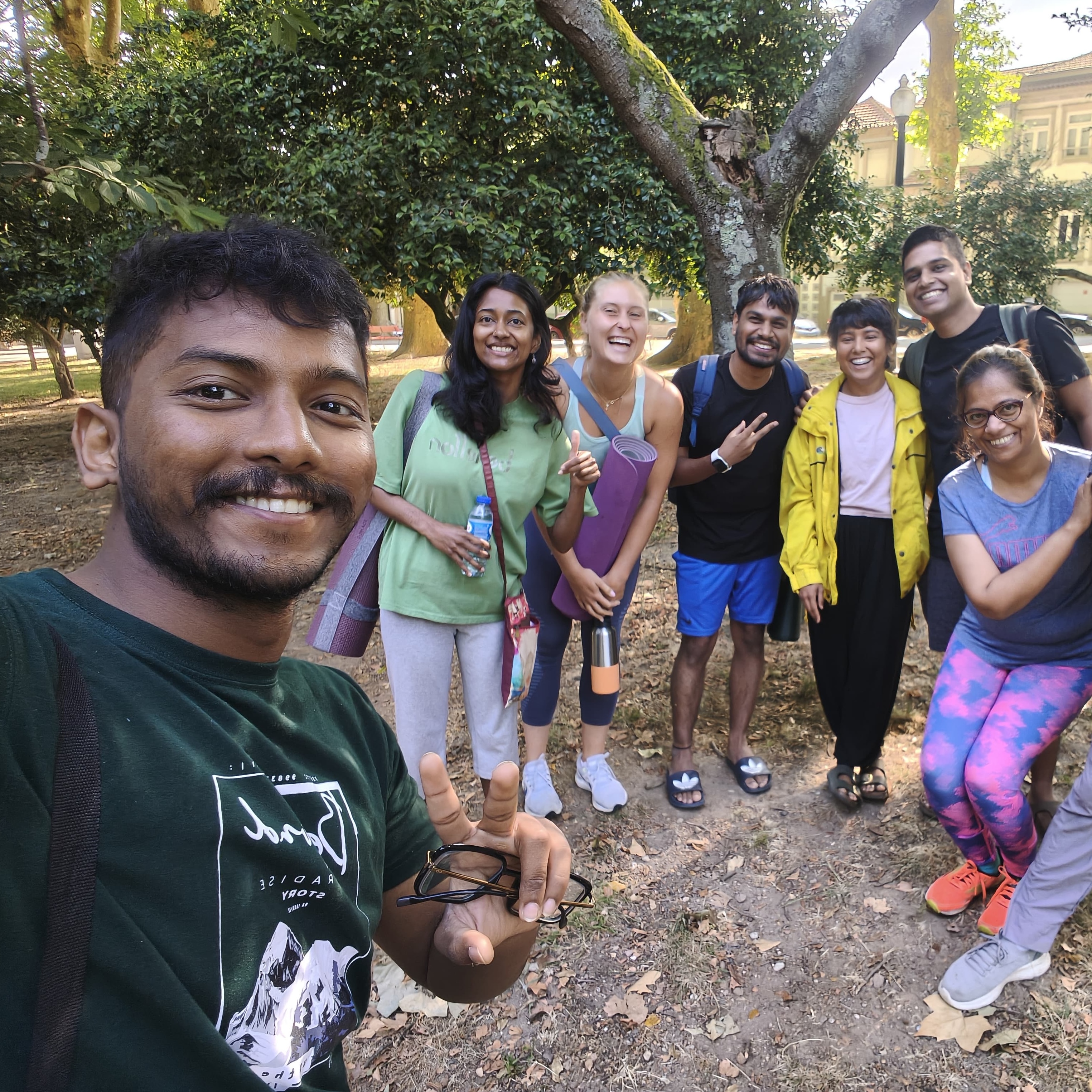 Group of yoga students and instructor outdoors